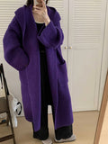 Women's loose grey hooded acrylic cardigan coat with long sleeves, shown open.