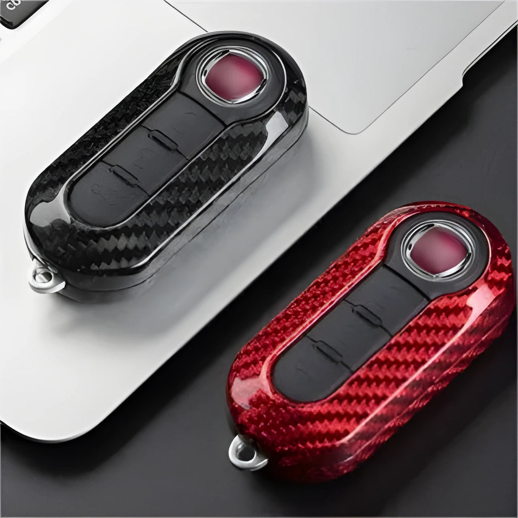 Carbon fibre and glass fibre replacement shell for car key fob on keyring.