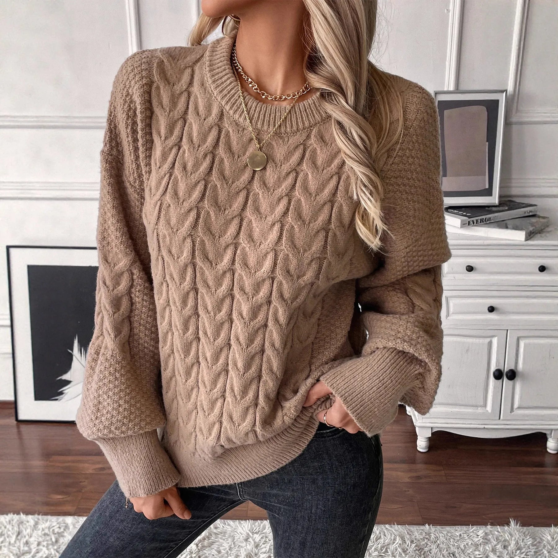 Women's beige casual sweater with a textured twist design and round neck.