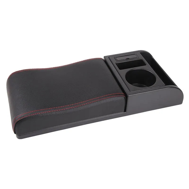 Universal plastic car armrest cover in PU leather black with red accent lines, shown on a centre console.