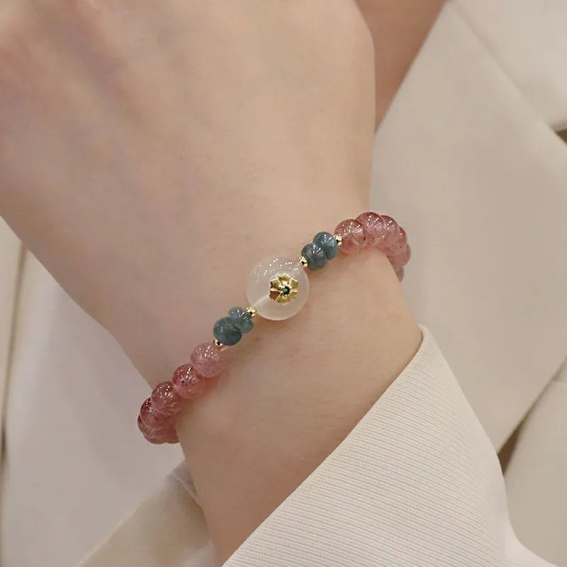 Strawberry quartz and blue water emerald pendant bracelet with round jade centrepiece and geometric diamond elements