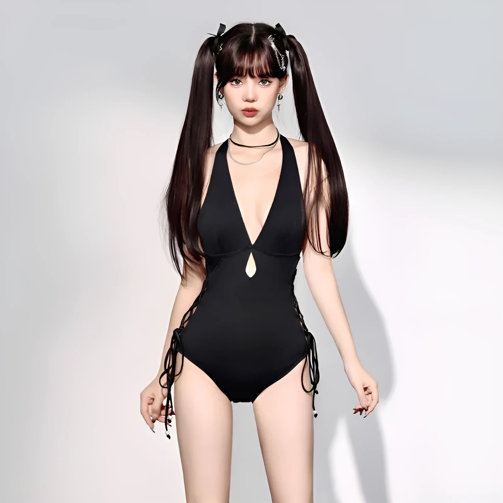 Black women's V-neck one-piece swimsuit with hollow strap design