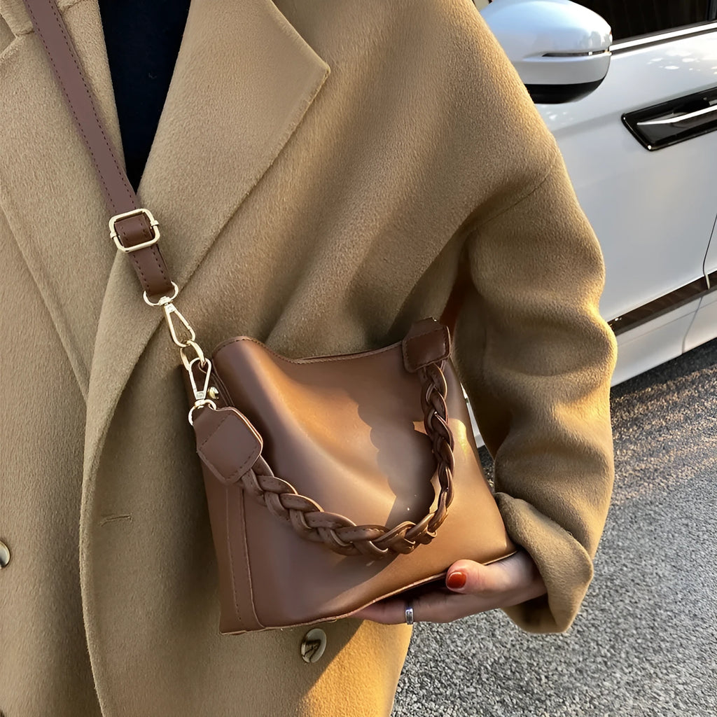 Khaki unisex PU crossbody bucket bag with woven texture and shoulder strap