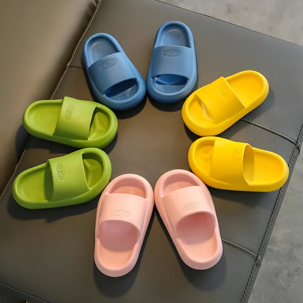 Children's bright coloured EVA slippers with a thick non-slip sole on a white background.