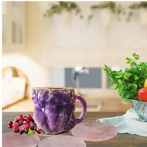 Purple resin coffee mug with handle showing crystal-like transparency on a table.
