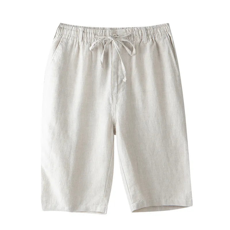 Men's loose-fit linen capri trousers in a straight leg style on a hanger.