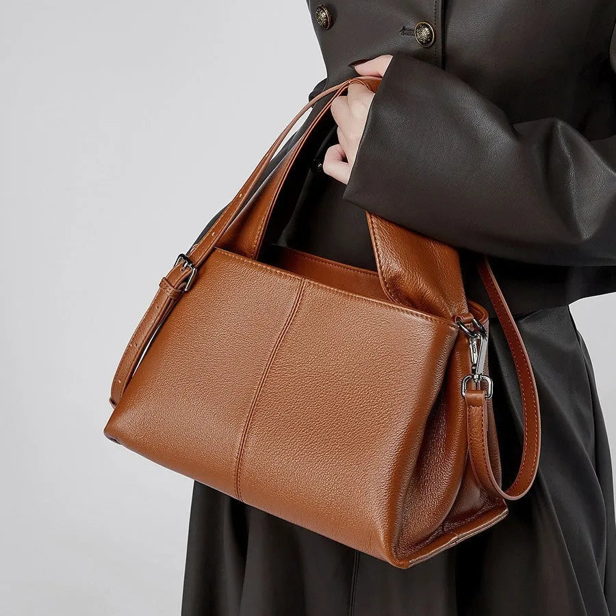Genuine cowhide leather messenger bag in urban style with sandwich pocket and double straps.