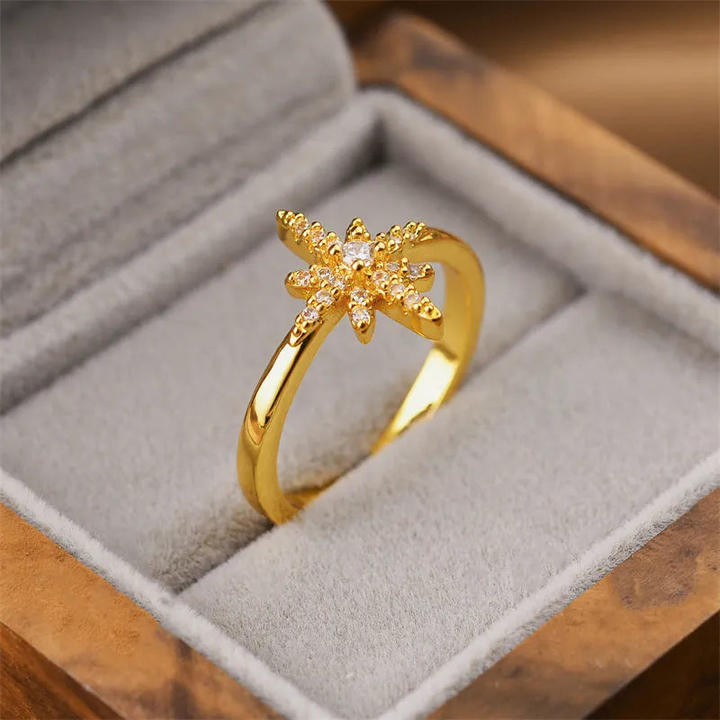 Gold geometric open ring for women made from electroplated copper.