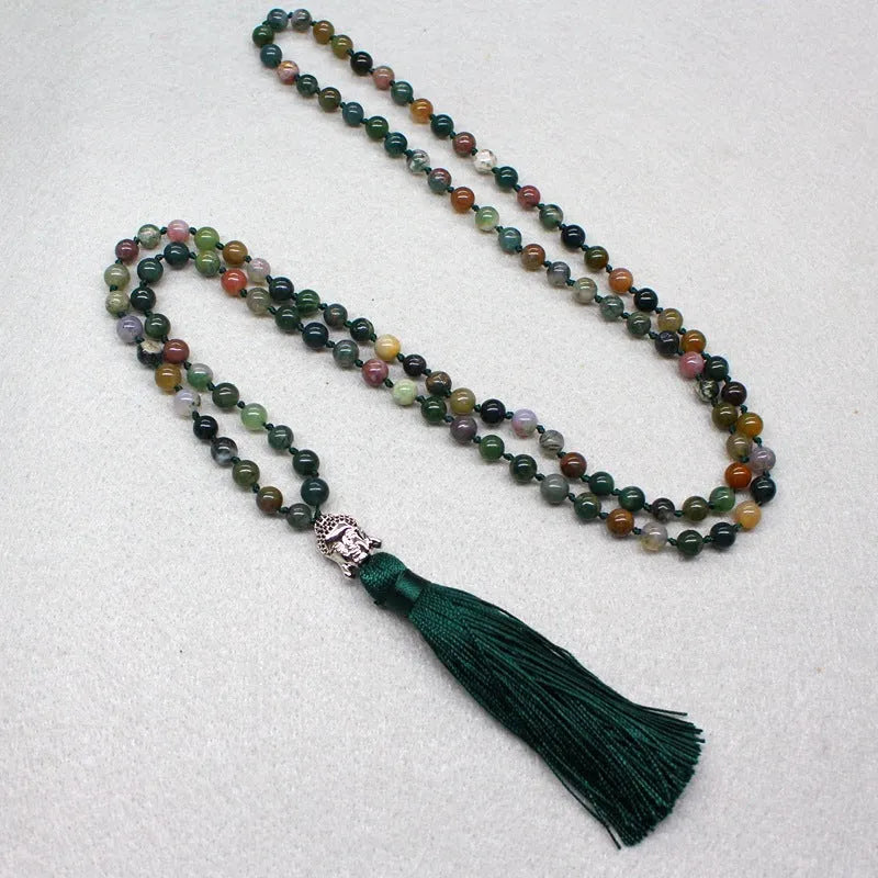 Natural agate bracelet with 108 geometric beads, each measuring 6mm, laid flat.