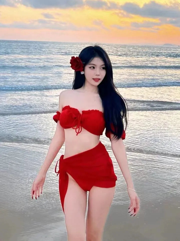 Red women's bikini swimsuit with puff sleeve top and skirt bottom