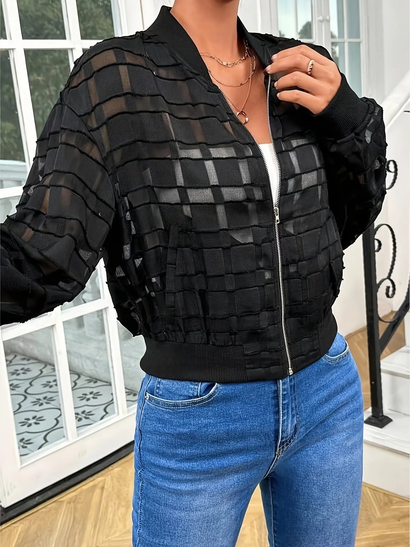 Black women's casual jacket with geometric pattern and thread zipper.
