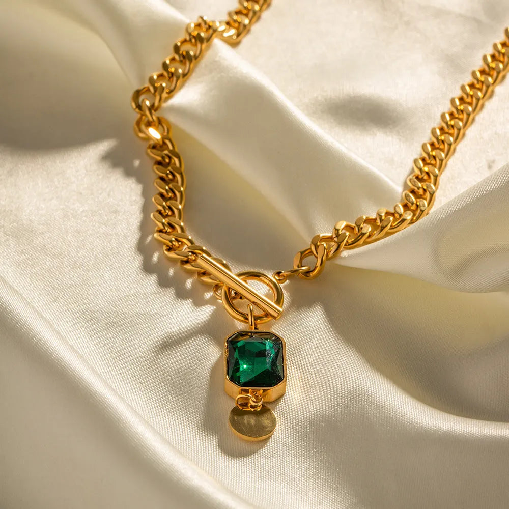 Gold titanium steel necklace with geometric round emerald zircon pendant on Cuban link chain