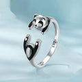 Adjustable sterling silver ring with a white gold plated panda design.