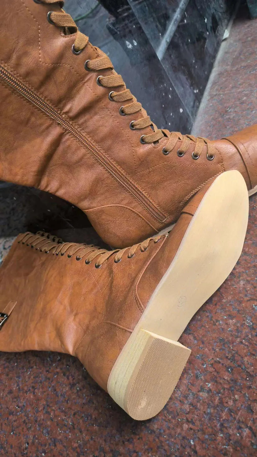 Women's black knight ankle boots with cross strap detailing, made from PU leather.