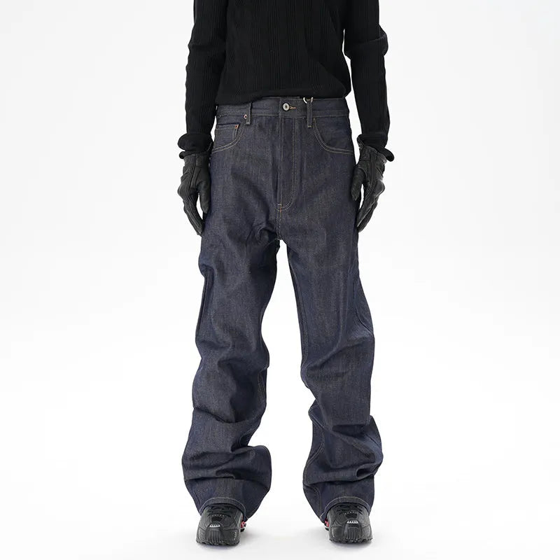 A pair of dark blue casual loose straight-cut jeans on a plain background.