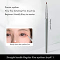 Close-up of a bend head eyeliner brush with a fine tapered tip for detailed eye makeup