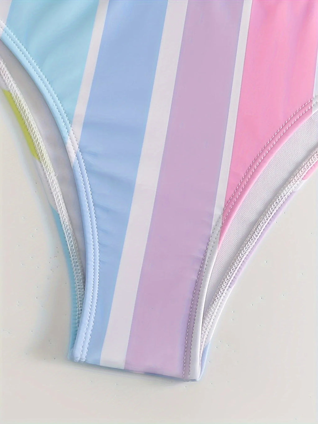Striped women's sports bikini set with a top and briefs on a white background
