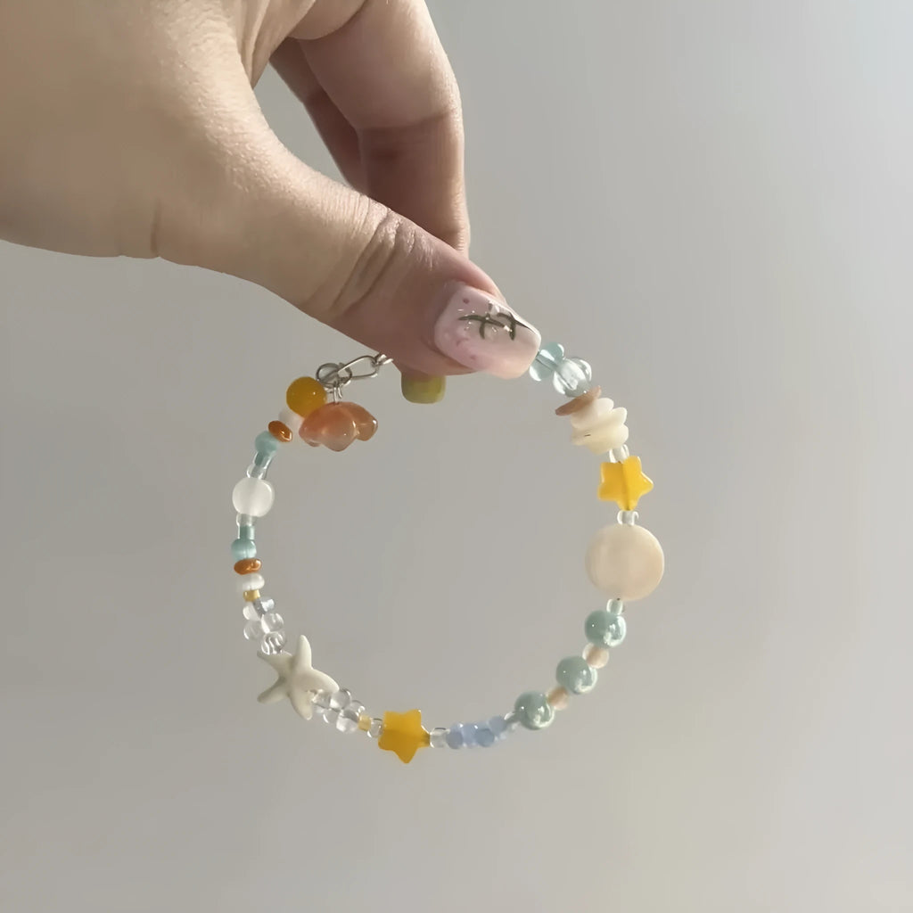 Orange sea summer bracelet with diamond shape design and round decorative elements