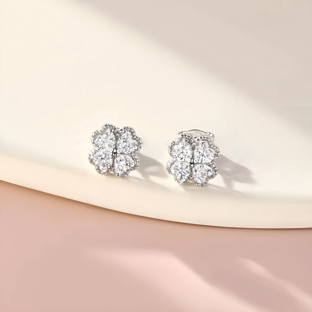 Pair of women's heart-shaped 925 silver earrings with four-leaf clover design and zircon stones.