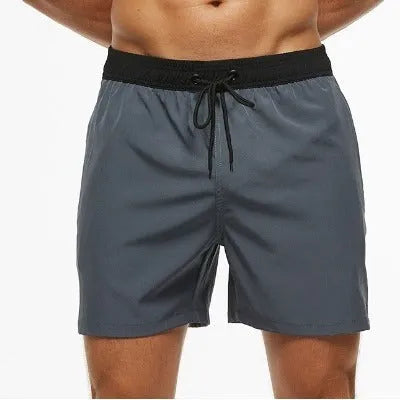 Men's blue stitching waist athletic shorts with drawstring and zipper pockets laid flat.
