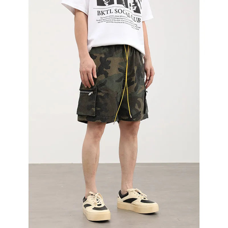 Men's camouflage pattern cargo shorts with multiple pockets and cropped leg length