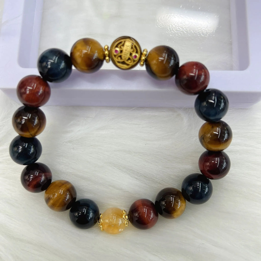 Brown tigereye stone round beads on Maillard chain bracelet showing natural banding patterns