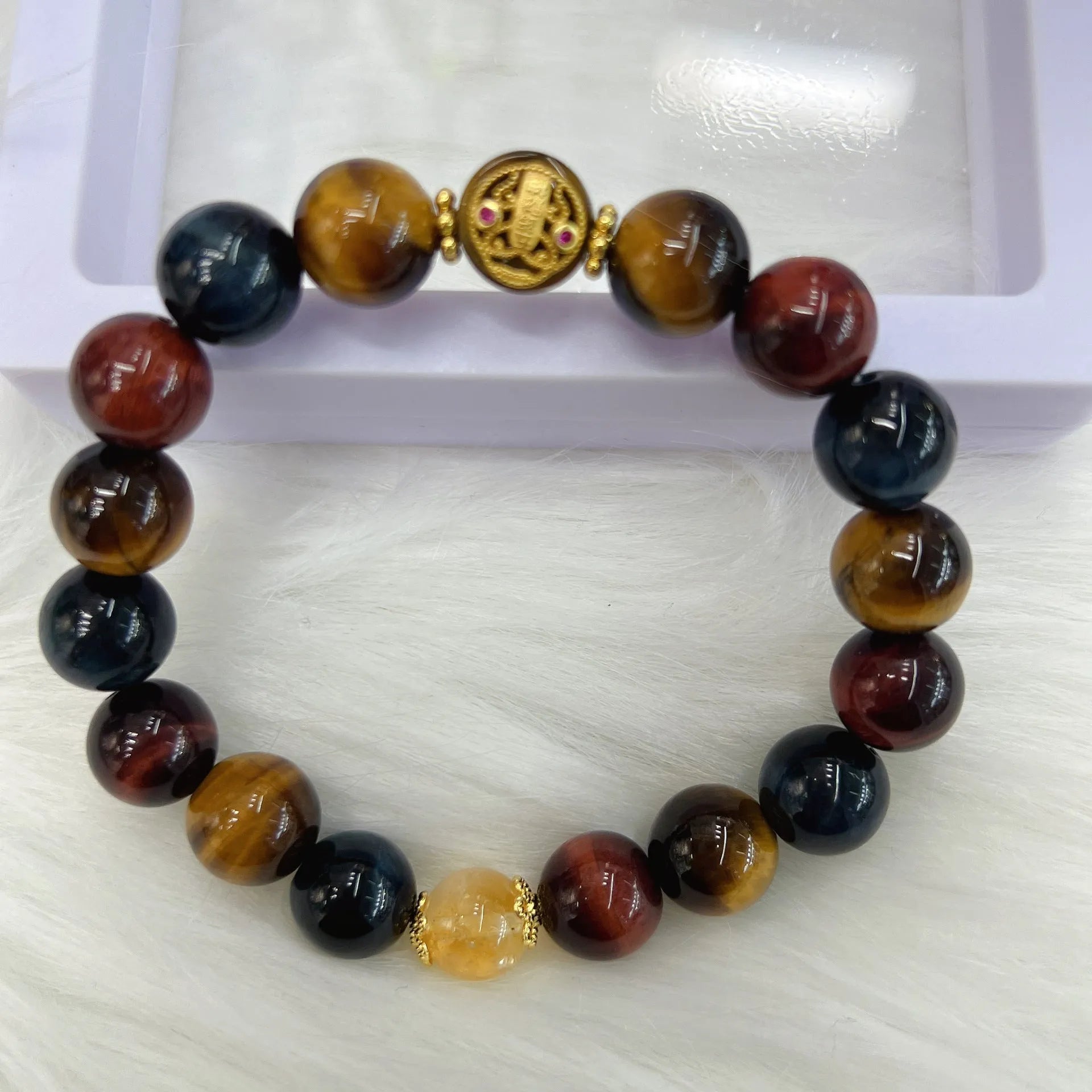 Brown tigereye stone round beads on Maillard chain bracelet showing natural banding patterns