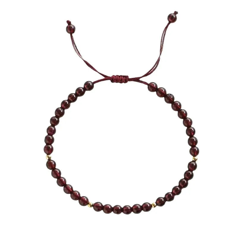 Hand-woven garnet red bracelet with flexible wire rope construction and Chinese national tide design