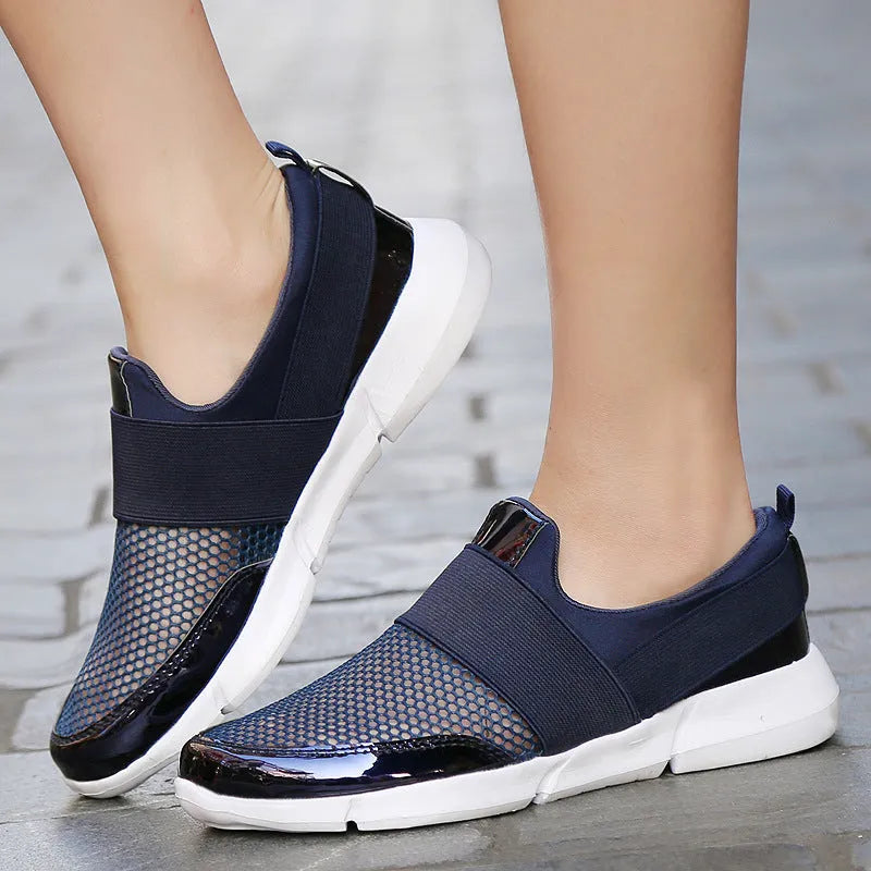 Women's low-top casual sneakers in blue, featuring a breathable mesh design and a PU midsole.