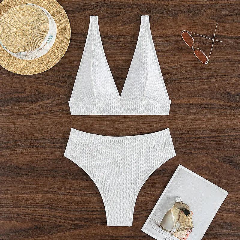 White women's backless two-piece bikini swimsuit set on a mannequin.