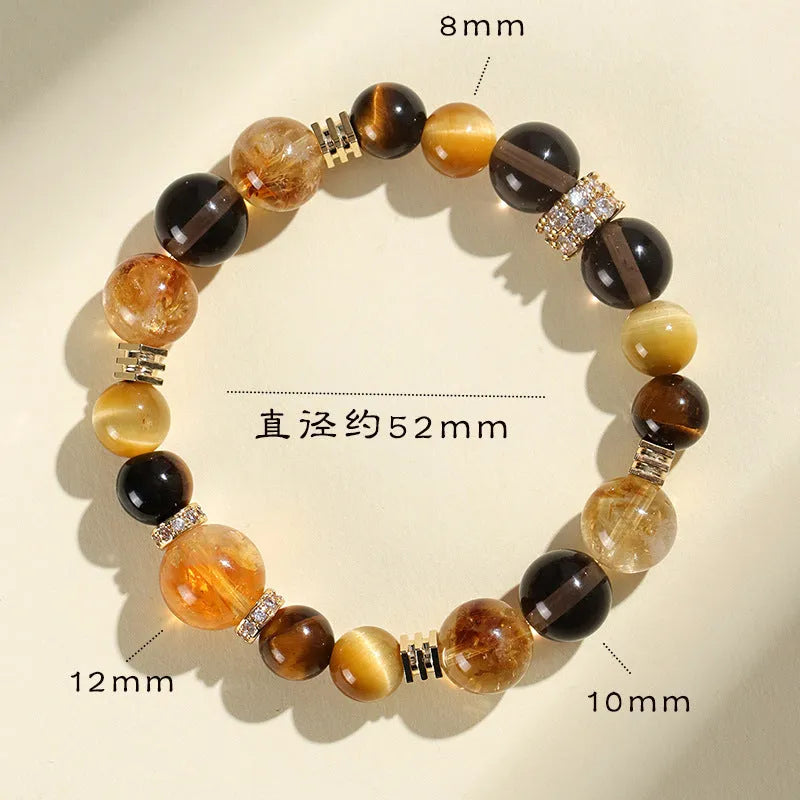 Close-up of a women's natural yellow bracelet with 10mm round artificial crystal beads on a string.