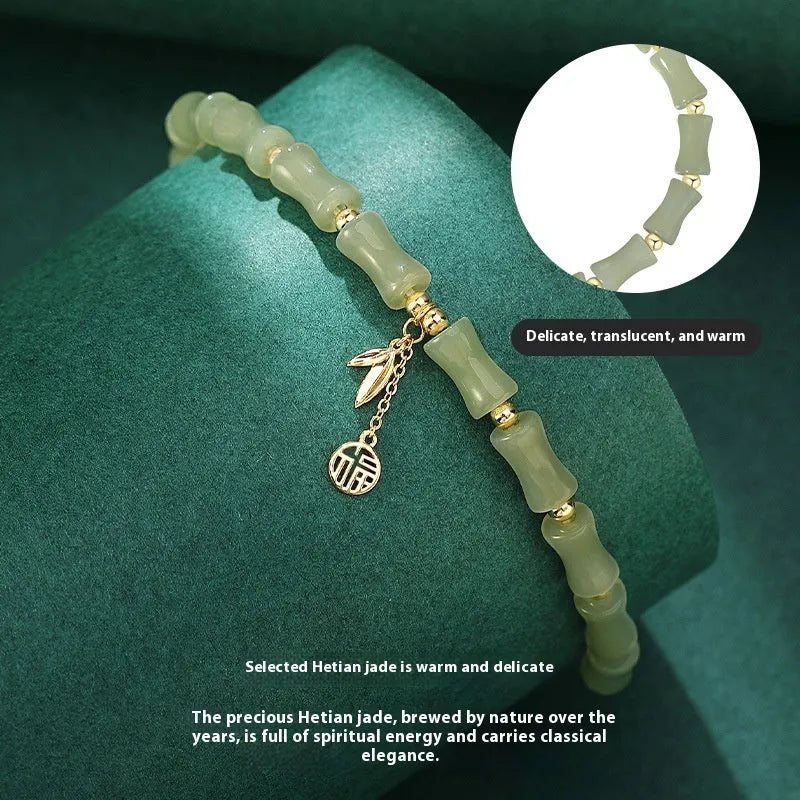 Green Chinese-style bamboo joint bracelet and necklace set made from alloy with Hetian jade accents.