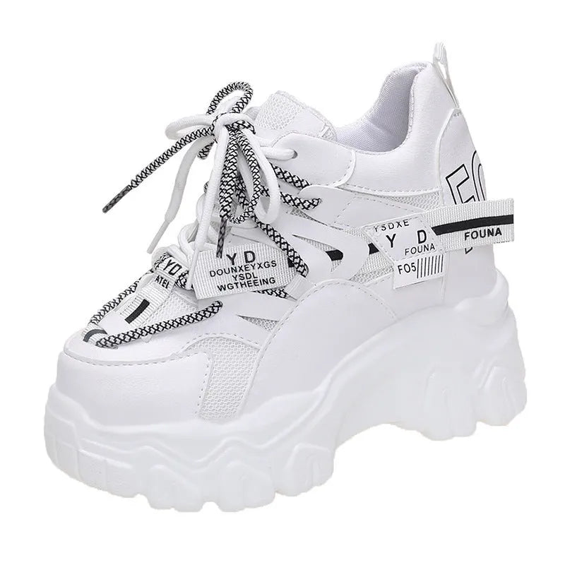 Women's white mesh platform sports shoes with a cross strap and rubber sole.