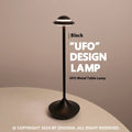 Modern metal UFO-shaped table lamp in black, gold, or grey with touch-sensitive dimming controls.