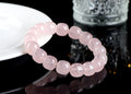 Natural pink crystal barrel bead bracelet with 11-12mm geometric design on wrist