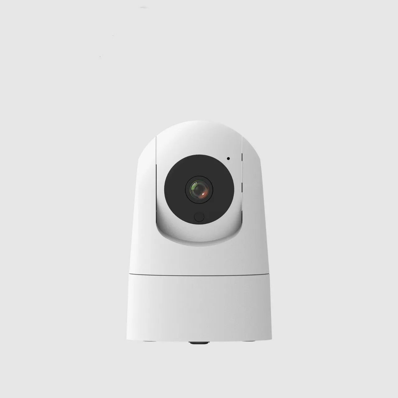 White indoor security camera with shake head function on a desk, showing UK plug.