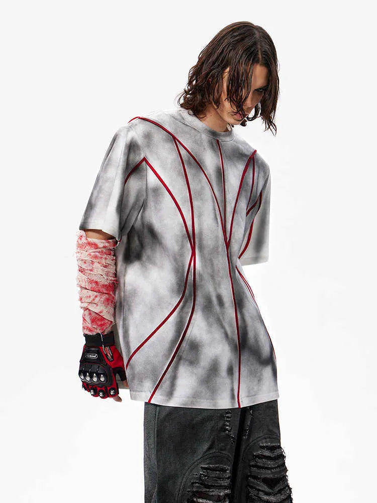 Women's short sleeve t-shirt with padded shoulders and three-dimensional line patchwork design on a round neck.