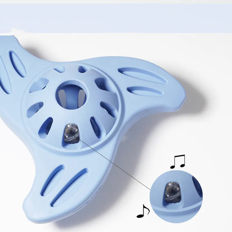 Blue boomerang-shaped dog chew toy with textured molar surface for dental cleaning