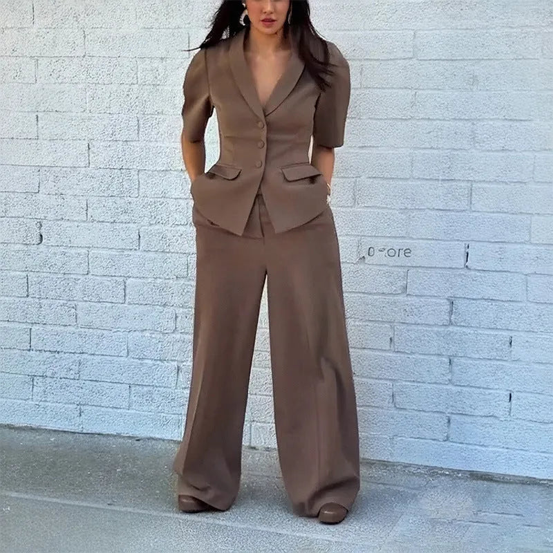 Brown men's slim fit two-piece polyester suit with long sleeves and trousers on a hanger.