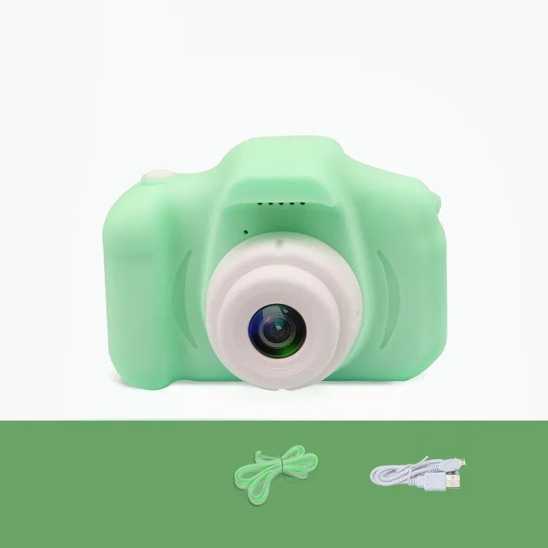 X2 HD mini cartoon kids digital camera in silicone body with 2-inch screen and lanyard.