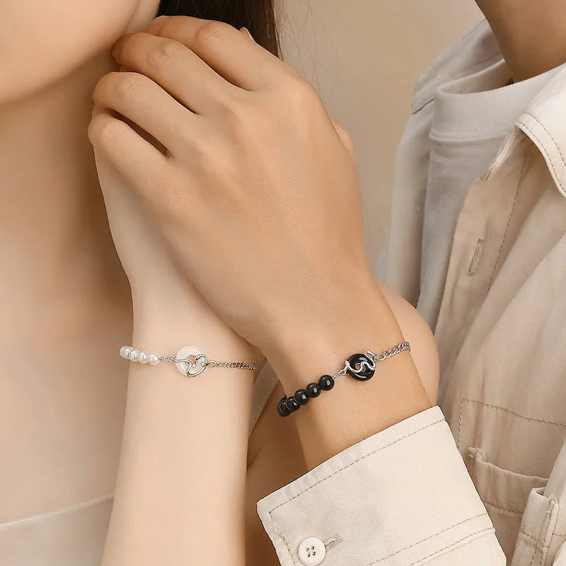 925 sterling silver bracelet with obsidian pearl, snake design, and safe buckle in New Chinese style.