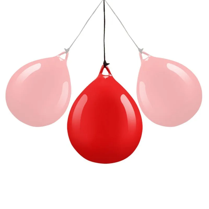 Red PVC water-filled boxing reaction ball with black hook rope sling for speed training.