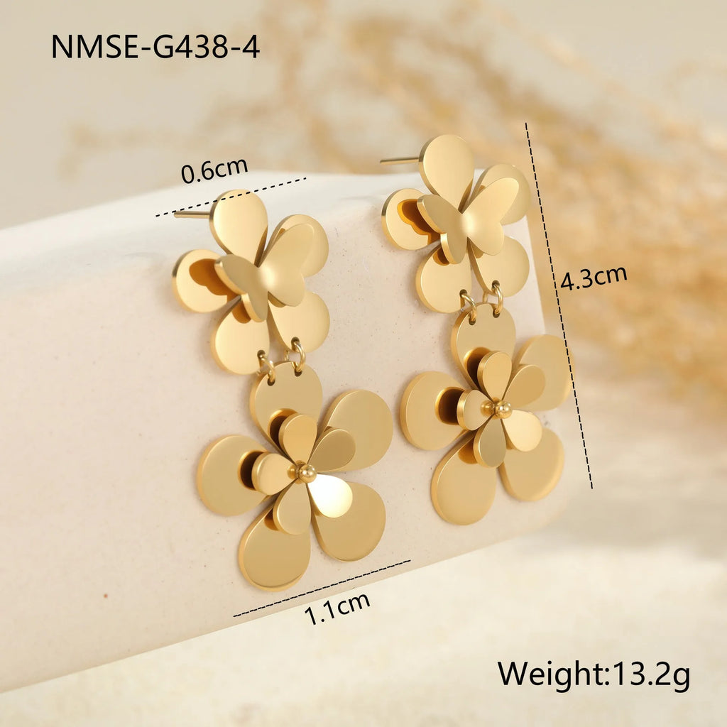 Gold flower butterfly earrings for women with geometric design on stainless steel.