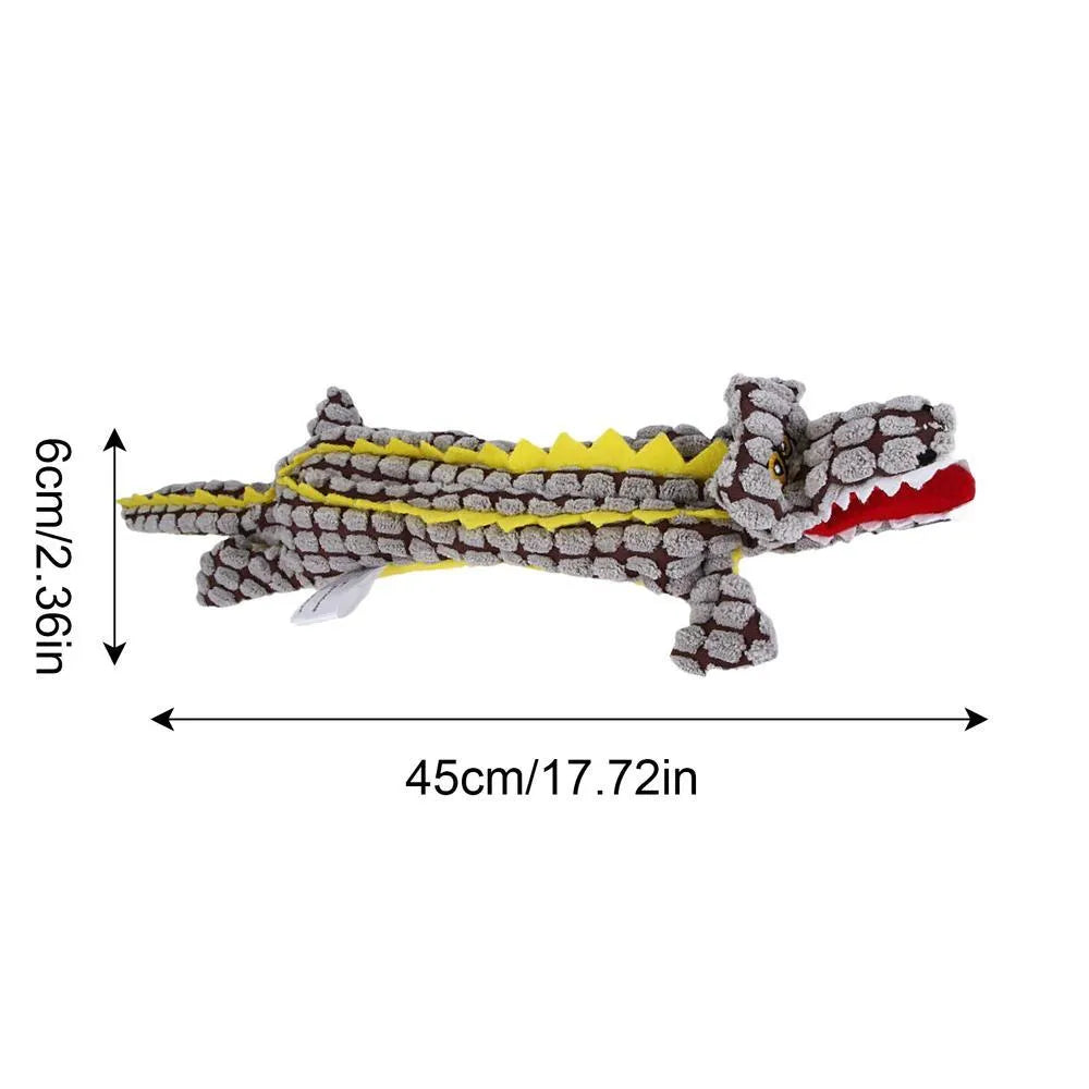 Crocodile-shaped plush dog toy with corduroy fabric detailing and squeaker inside
