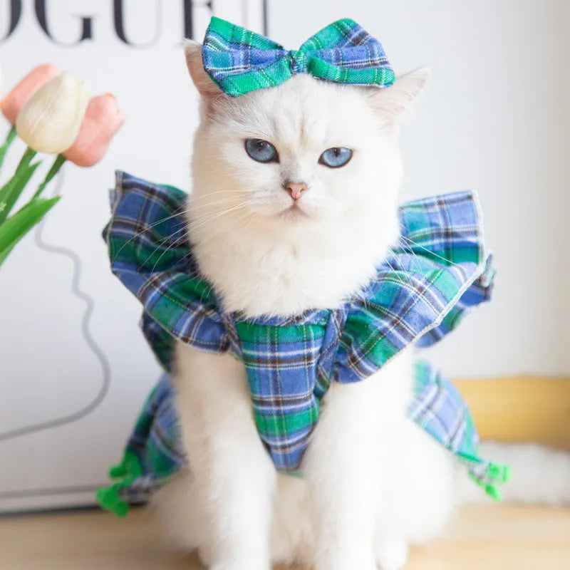 Pet wearing Christmas tartan plaid skirt with matching head flower and bow tie festive costume