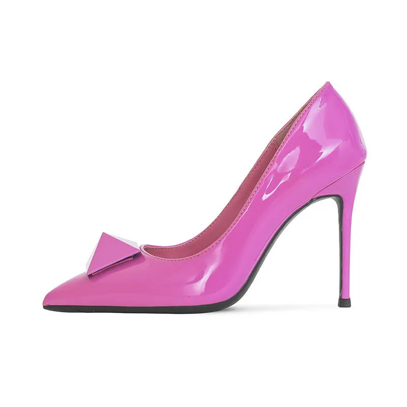 Pink patent leather women's stiletto high heels with pointed toe and decorative rivet buckle.