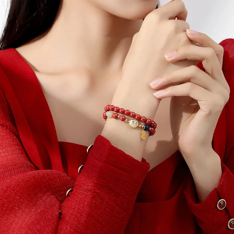 S925 sterling silver bracelet with white shell and cinnabar blessing card charm.