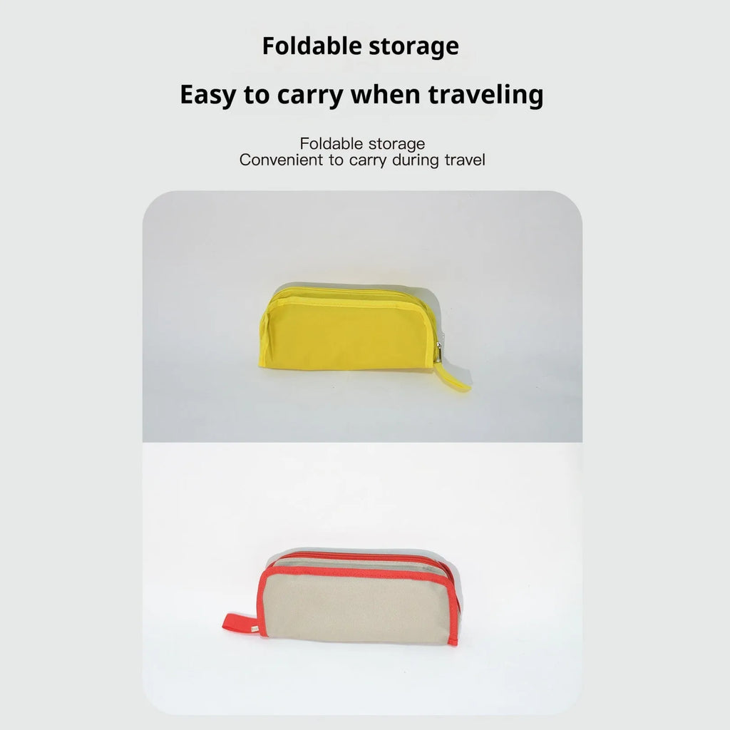 Lightweight foldable camping stool in Oxford cloth shown in a khaki colour, folded to a slim profile.