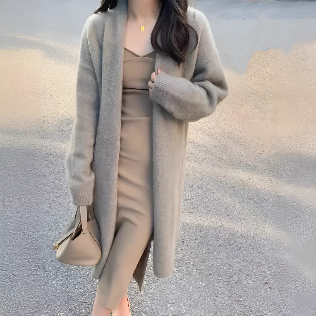 Women's mid-length knitted V-neck cardigan in a loose fit, shown in khaki colour.
