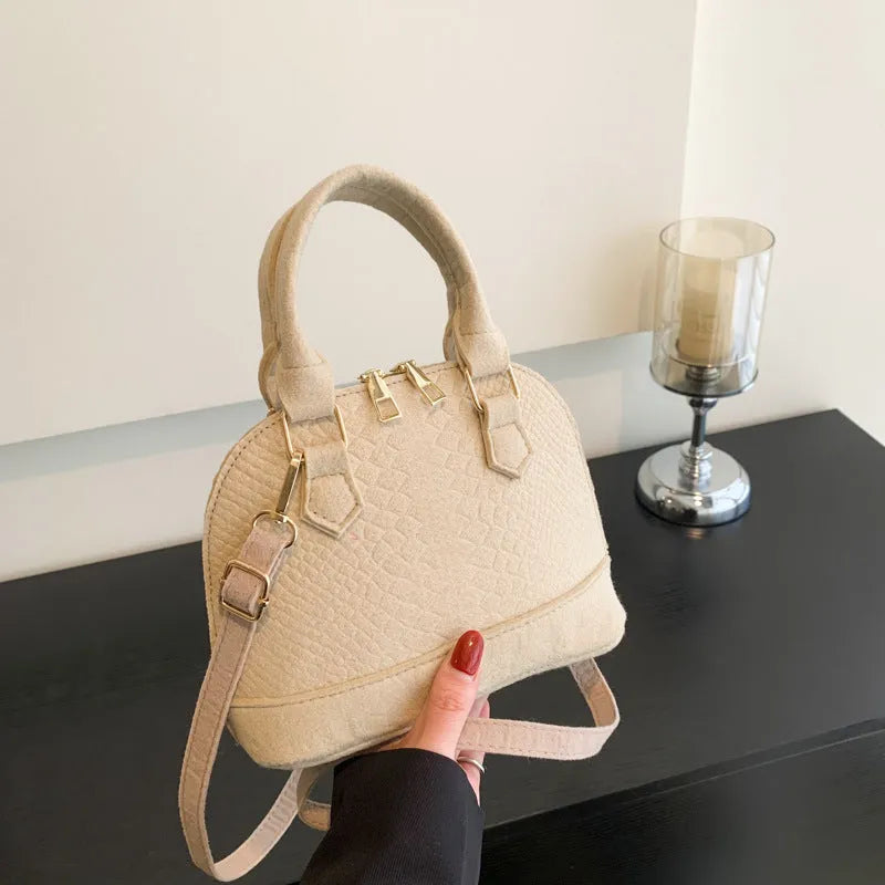 Women's felt shell-shape crossbody bag in khaki with embossing detail and single strap
